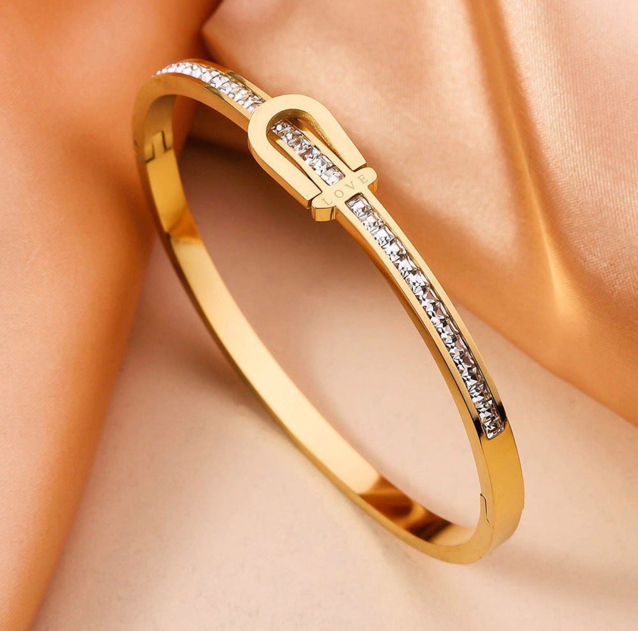 18K Gold-Plated stainless steel bangle featuring a belt buckle