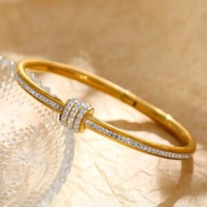 18K Gold Plated Bangle features a zircon-embellished barrel clasp