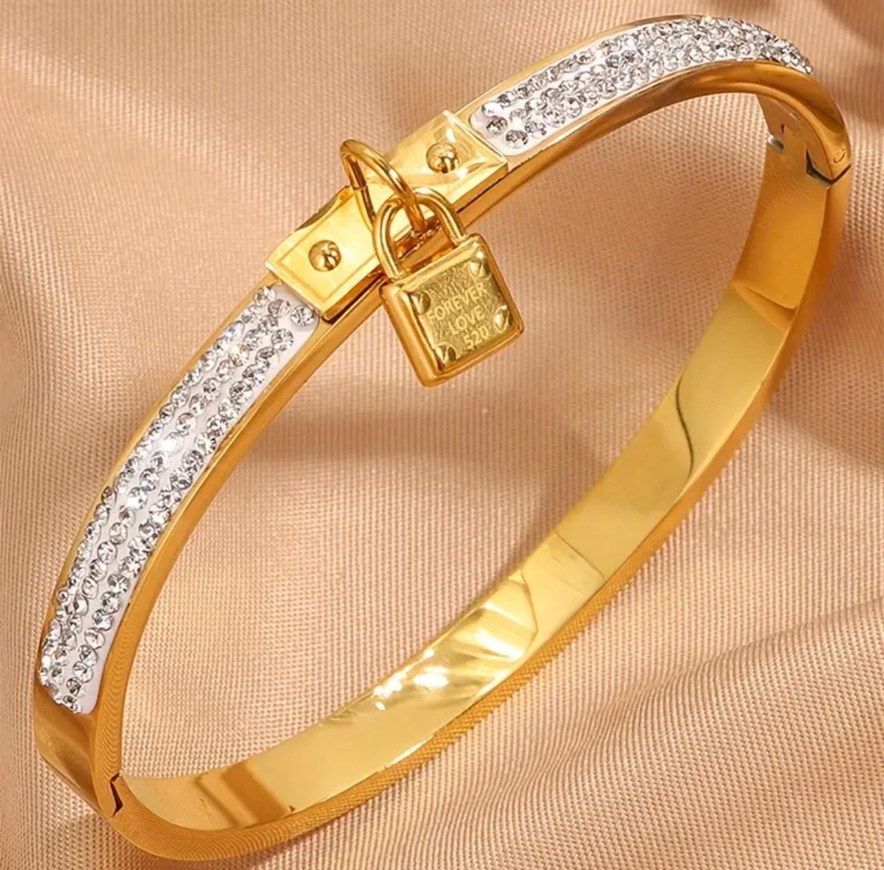 18K Gold-Plated Charm Bangle featuring a rhinestone-embellished lock charm with "Forever Love" text.