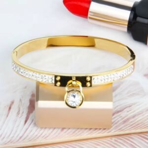 18K Gold-Plated meticulously paved with two rows of sparkling cubic zircon stones and a dangling round