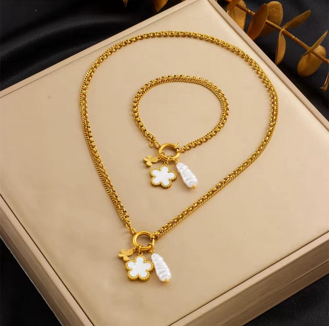 18K Gold-Plated set features a DIEYURO flower and pearl pendant necklace and bracelet