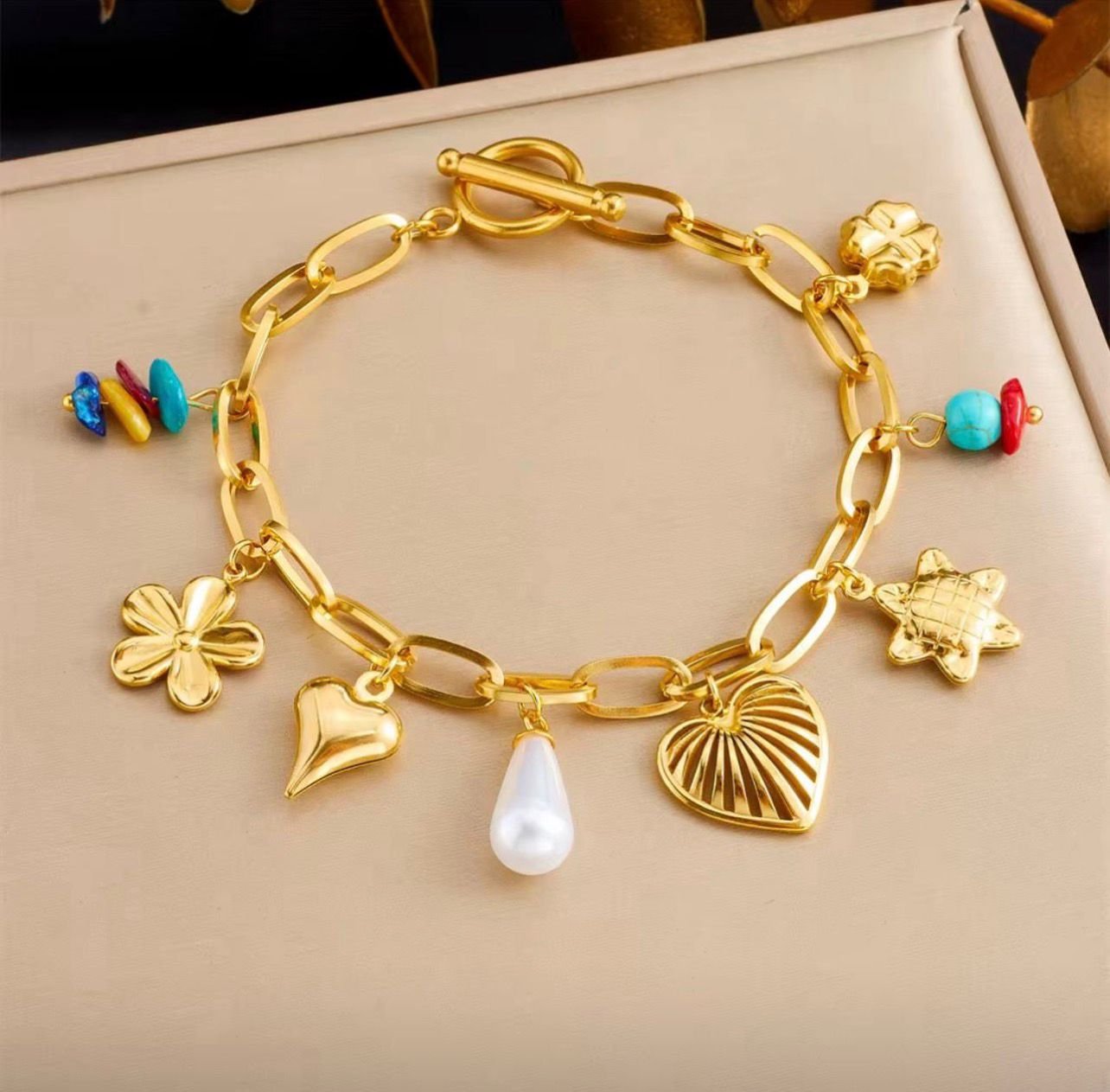 18K Gold-Plated charm bracelet featuring heart, pearl, and turquoise accents
