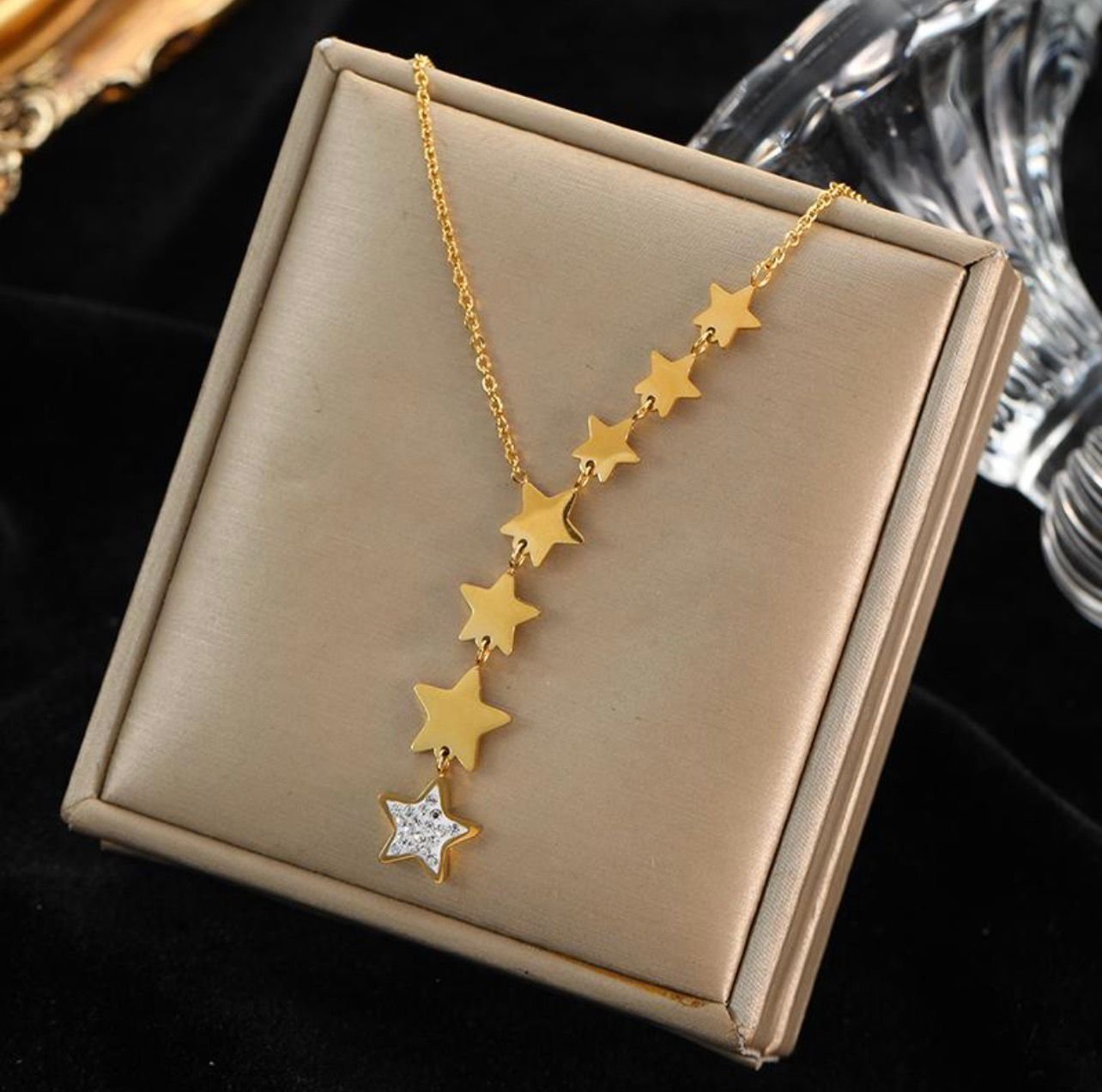 18K Gold-Plated Gold Star Lariat (Y) Necklace with a drop of multiple stars and a final star accented by zircon
