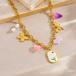18K Gold-Plated necklace with a central elliptical pendant with an enameled tulip and a red sun motif surrounded with several smaller charms