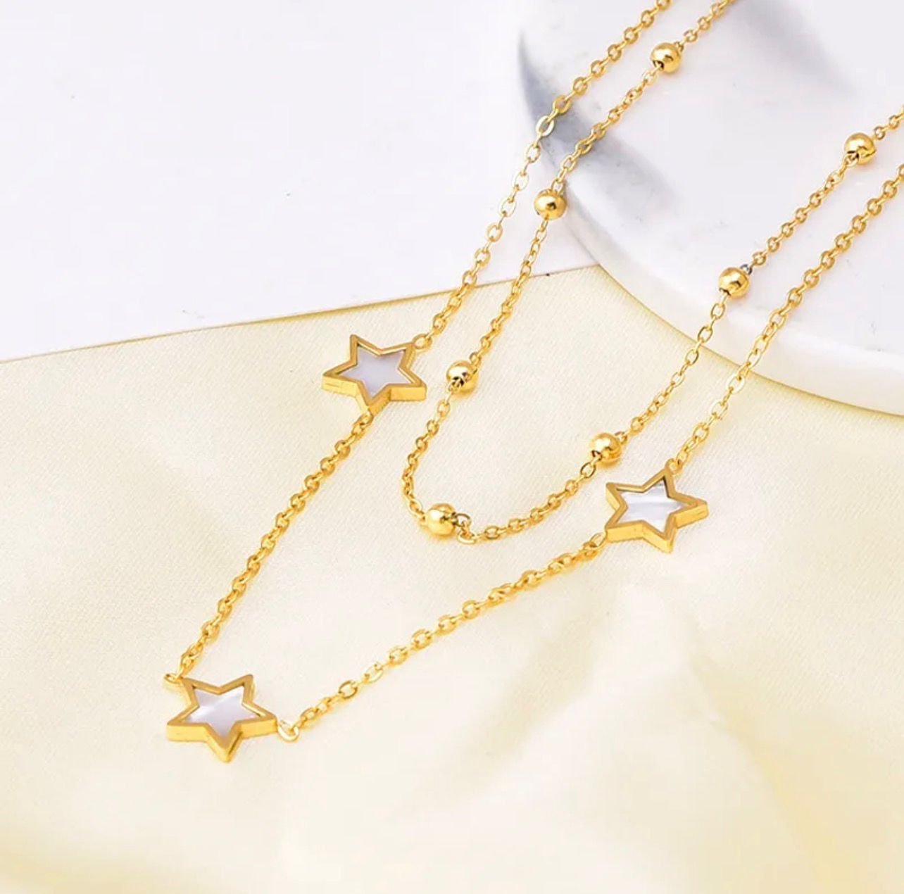 18K Gold-Plated double-layer necklace featuring star-shaped pendants with a white mother-of-pearl finish