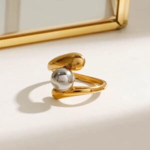 18K Gold-Plated asymmetrical open ring featuring a “bypass” style band that wraps around a polished silver pearl
