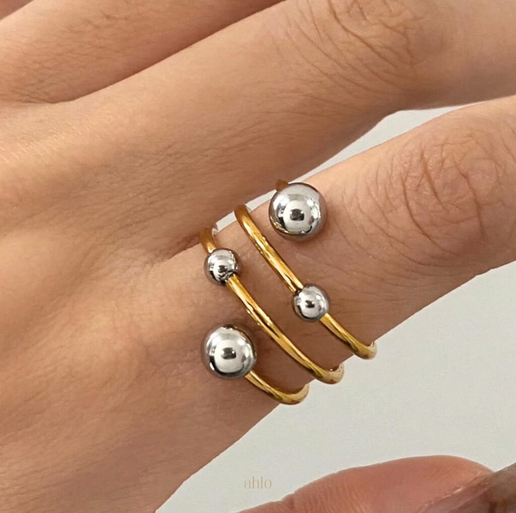 18K Gold-Plated multi-layer open wrap design that coils around the finger, accented with different-sized metallic spheres