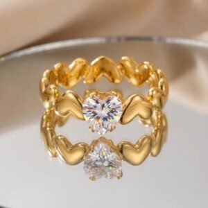 18K Gold Plated adjustable heart-shaped ring.It features a puffy heart-shaped band accented by a central heart-shaped clear cubic Zircon stone