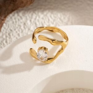 18K Gold-Plated  ring with a center features a square cubic zircon stone set within an irregular, fluid-shaped frame