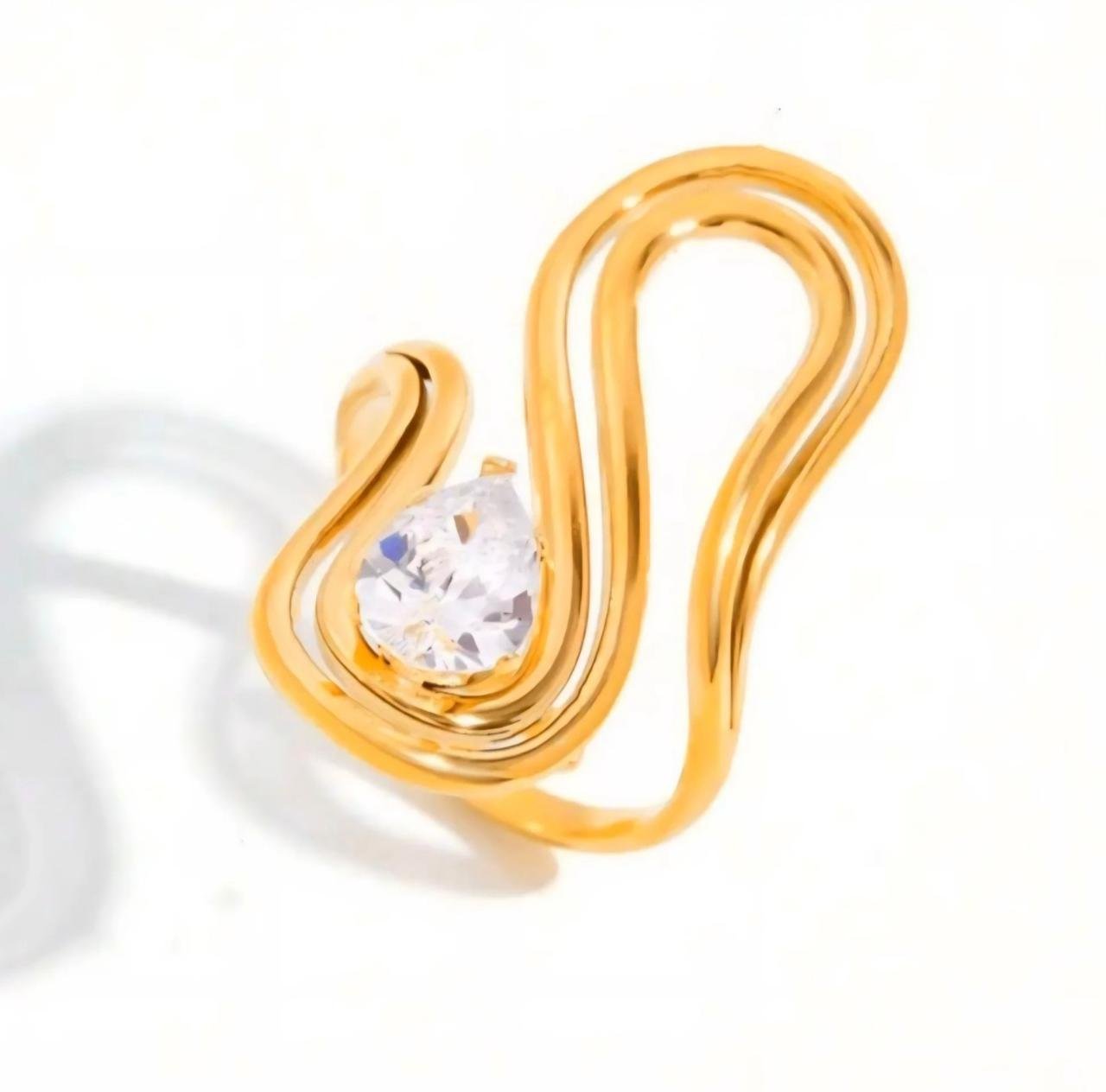 18K Gold-Plated sculptural solitaire ring features a pear-cut solitaire set on a streamlined, adjustable gold band with zircon stone