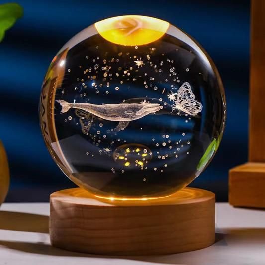 3D engraved crystal ball night light featuring a whale and butterfly design