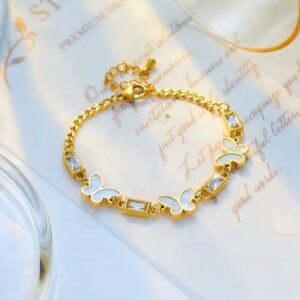 18K Gold-Plated butterfly bracelet featuring white shell butterflies, and baguette cubic zirconia stones